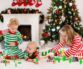 Children playing toy train together Stock Photo 04