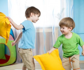 Children playing with pillows Stock Photo 01