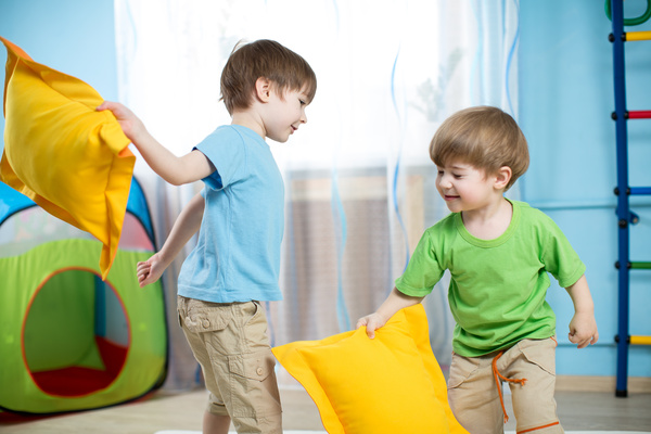 Children playing with pillows Stock Photo 01