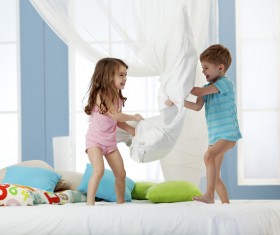 Children playing with pillows Stock Photo 02
