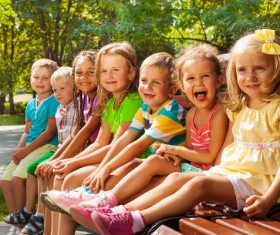 Children sitting on the bench Stock Photo