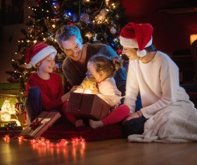 Christmas Eve received a teddy bear gift happy little sister Stock Photo