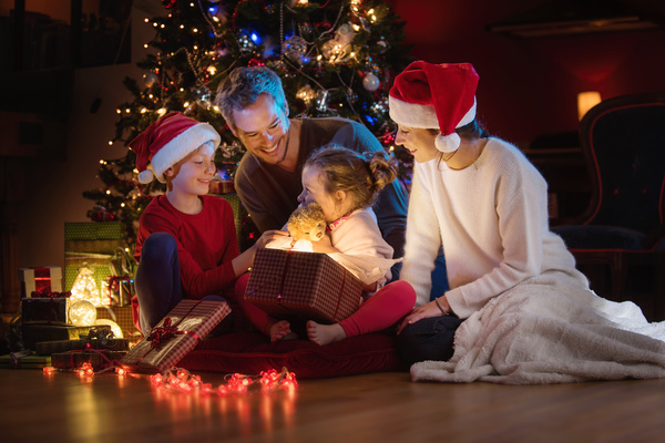 Christmas Eve received a teddy bear gift happy little sister Stock Photo