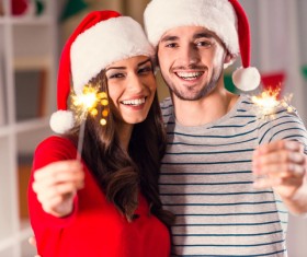 Christmas couple put fireworks Stock Photo 01