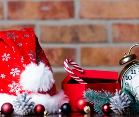 Christmas hat and alarm clock on the desktop Stock Photo