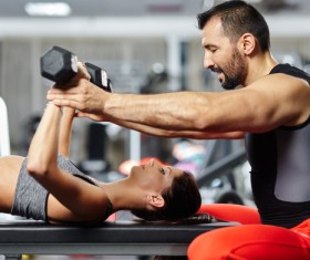 Coach corrects girl sport gesture Stock Photo 02