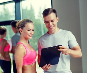 Coach to see trainee fitness data Stock Photo