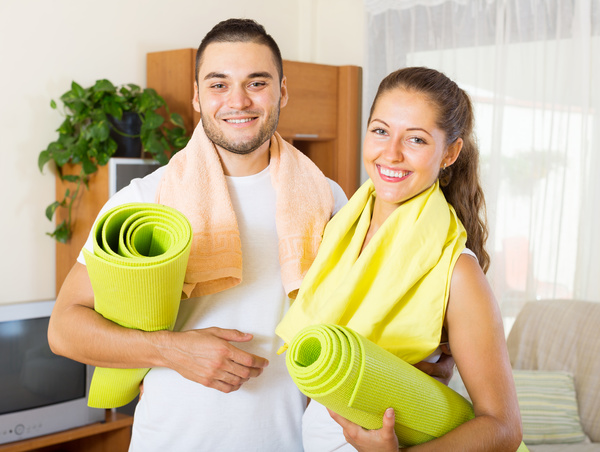 Couple doing fitness exercise together Stock Photo