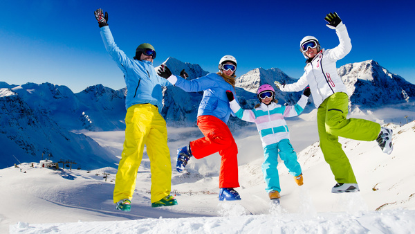 Family enjoying winter skiing fun Stock Photo 01