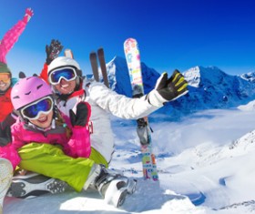 Family enjoying winter skiing fun Stock Photo 09