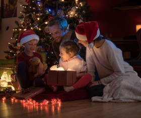 Family sitting together on Christmas Eve Stock Photo 01