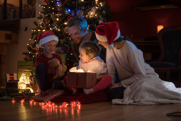 Family sitting together on Christmas Eve Stock Photo 01