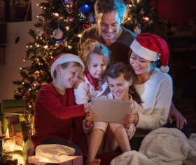 Family sitting together on Christmas Eve Stock Photo 03
