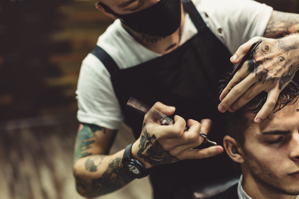 Fashionable male hairdresser Stock Photo