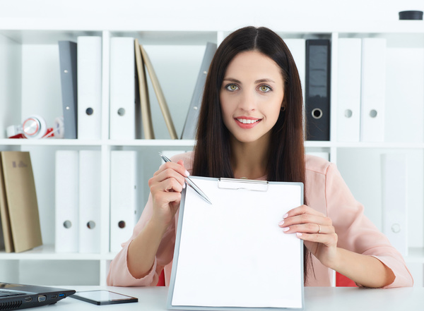 Female holding record book and pen Stock Photo