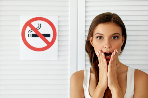 Girl and quit smoking sign Stock Photo 01