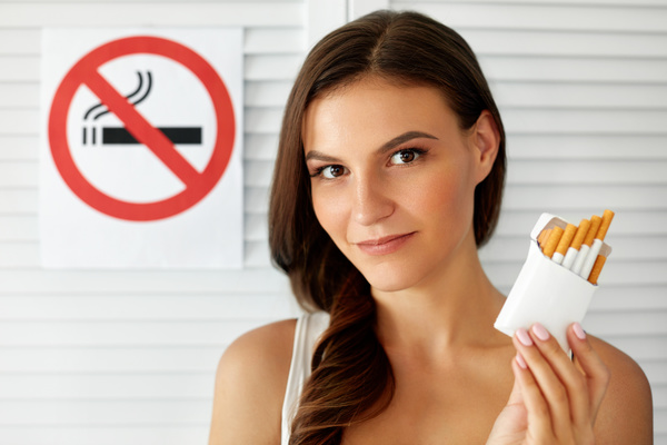Girl and quit smoking sign Stock Photo 02