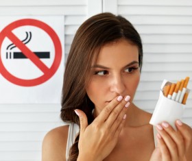 Girl and quit smoking sign Stock Photo 03
