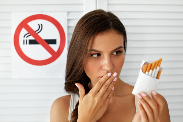 Girl and quit smoking sign Stock Photo 03