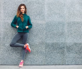 Girl leaning on the wall Stock Photo 01