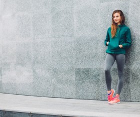 Girl leaning on the wall Stock Photo 02
