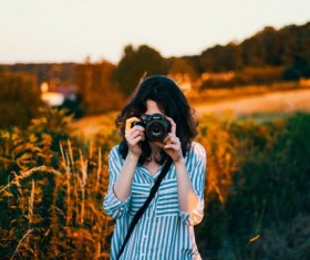 Girl photographed with camera Stock Photo