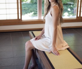 Girl sitting indoors Stock Photo