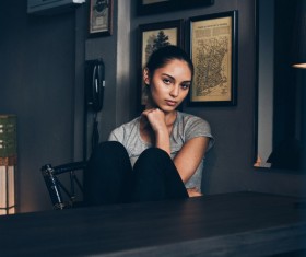Girl sitting on chair Stock Photo