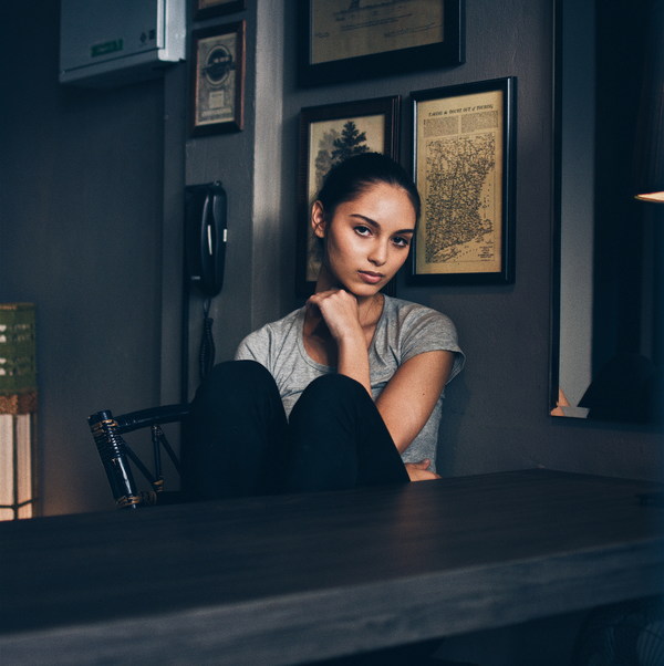 Girl sitting on chair Stock Photo