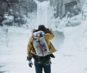 Girl watching glacier in the mountains Stock Photo