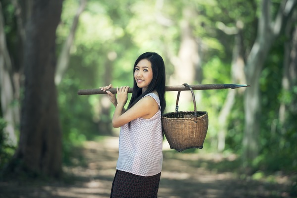 Girl with tool to the forest picking Stock Photo