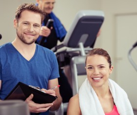 Gym smiling men and women Stock Photo