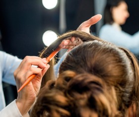Hairdresser doing hairstyle Stock Photo