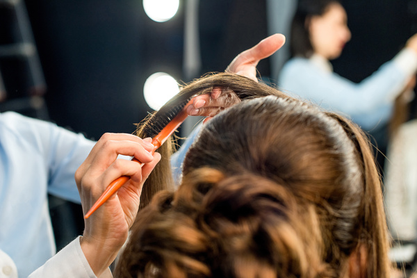 Hairdresser doing hairstyle Stock Photo