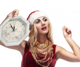 Hand holding the clock waiting for Christmas Eve Stock Photo
