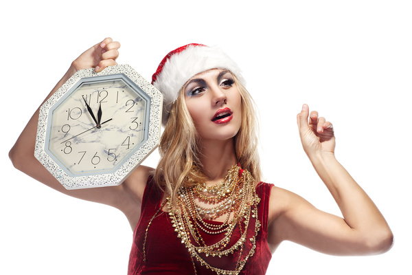 Hand holding the clock waiting for Christmas Eve Stock Photo
