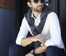 Handsome fashion man sitting on the steps Stock Photo
