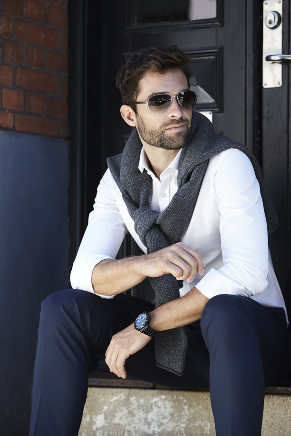 Handsome fashion man sitting on the steps Stock Photo
