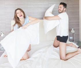 Happy couple pillow fight Stock Photo 01