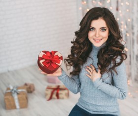 Happy girl holding a gift box Stock Photo 01