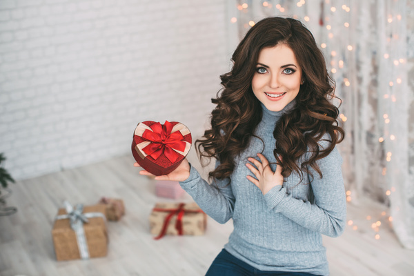 Happy girl holding a gift box Stock Photo 01