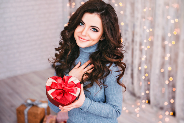 Happy girl holding a gift box Stock Photo 02
