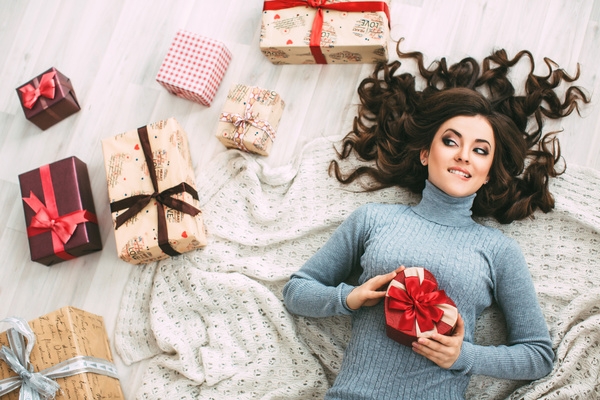 Happy girl holding a gift box Stock Photo 03