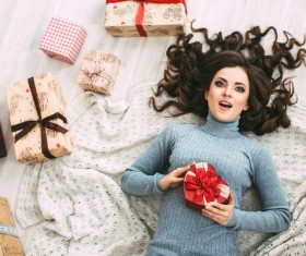 Happy girl holding a gift box Stock Photo 04
