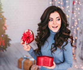 Happy girl opens gift box Stock Photo