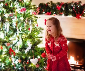 Happy little girl decorated Christmas tree Stock Photo 01