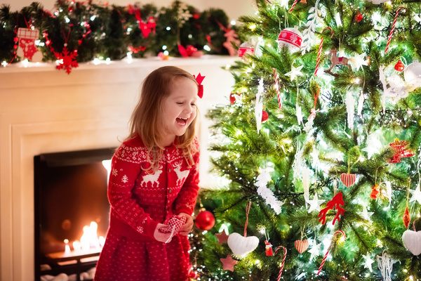 Happy little girl decorated Christmas tree Stock Photo 04