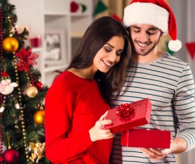 Happy woman opening Christmas gift Stock Photo 01