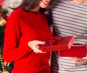 Happy woman opening Christmas gift Stock Photo 02