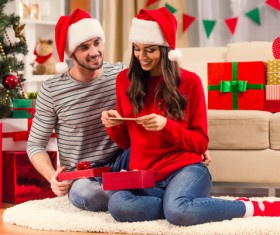 Happy women take pictures of gifts with smartphones Stock Photo